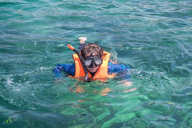 Phi Phi & Khai Islands Speedboat Tour from Phuket with Snorkeling - Phi Phi Don and Pileh Lagoon: swimming and a beach lunch reset